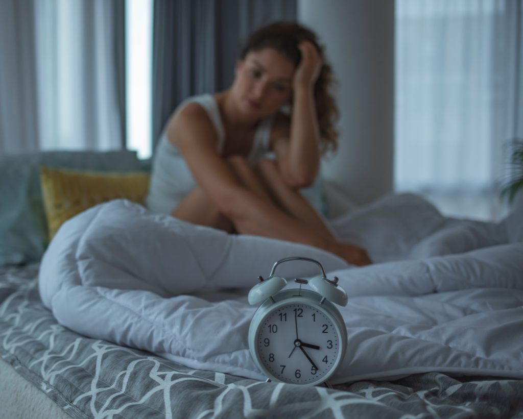 Someone Awake With Alarm Clock On Side Table